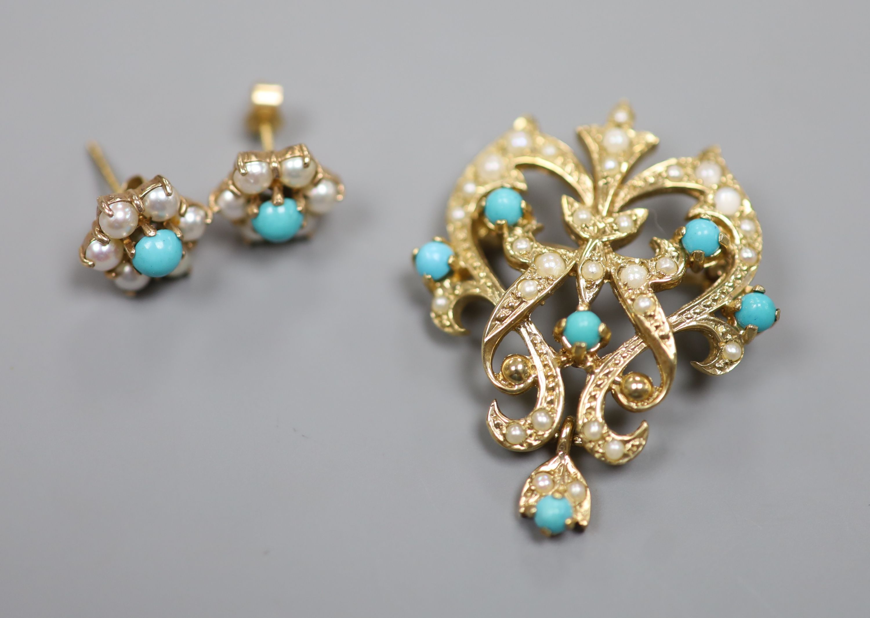 A modern 9ct gold, seed pearl and turquoise set scrolling pendant brooch, 34mm and a pair of matching ear studs